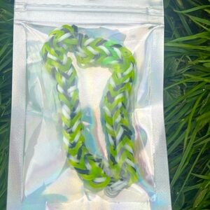 A green black and white bracelet